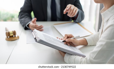 Law Concept The Lawyer Partner Who Wears Simple White Shirt Attempting To Catch Up And Write Down From What Her Boss Says.