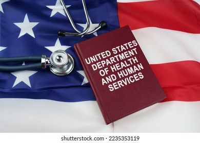 Law concept. On the US flag lies a stethoscope and a book with the inscription - United States Department of Health and Human Services - Shutterstock ID 2235353119