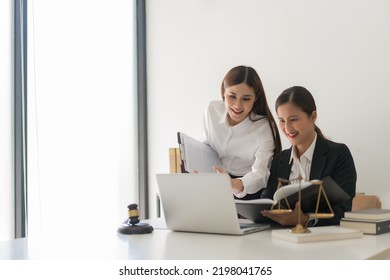 Law concept, Two female lawyers discussing about contract and agreement of business in law firm. - Shutterstock ID 2198041765
