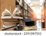 Law education, legal educational study, school for lawyer, legistration, litigation, judicial knowledge learning concept with court judge gavel and textbook with mortarboard on books in library