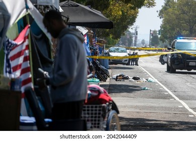 Law enforcement investigate the scene of a fatal stabbing at a homeless encampment in Brentwood area, near the West Los Angeles VA complex, in Los Angeles, Wednesday, Sept. 15, 2021. 