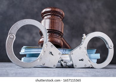 Law Gavel With Handcuff And Banknotes Close-up. Bail Or Corruption Concept