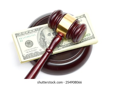 Law Gavel On A Stack Of American Money.