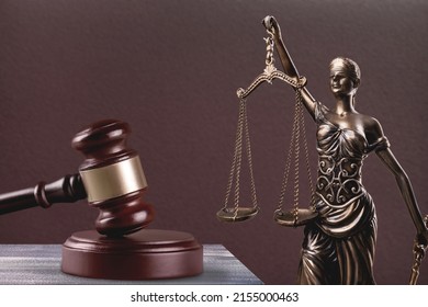 Law And Judgment Concept. Figure Of Lady Justice With Stack Book.