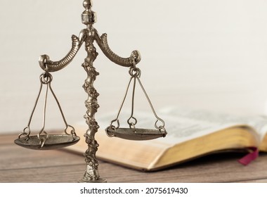 Law And Justice Christian Biblical Concept. Old Ancient Vintage Weighing Scale Balance With Open Holy Bible Book With White Background. God Jesus Christ Righteous Judge On Judgement Day. A Close-up.