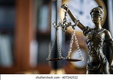 Law and Justice concept with gavel and scale in background. Composition in court library