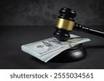 Law and justice concept. Judge hammer with the dollar placed - concept of judgment and justice. About fraud tax fines.