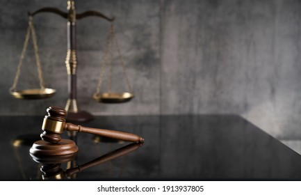 Law and Justice concept. Mallet of the judge. Gray background, place for typography. Courtroom theme. - Shutterstock ID 1913937805