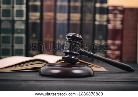 Law and Justice , Legality concept, Judge Gavel and law book on a black wooden background, law library concept.