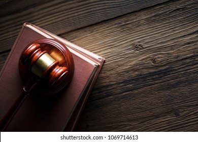 Law and justice. Mahogany gavel on books. Wooden table. Copy space. - Shutterstock ID 1069714613