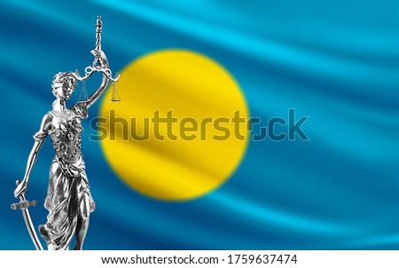 Law and justice in Palau. Palau flag with Themis.