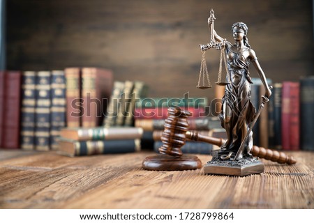 Law and justice symbols. Bokeh background.