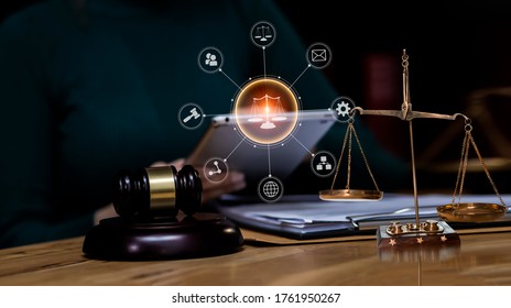 Law And Legal Services Concept, Good Service Cooperation, Lawyer Hands Using Tablet And Working On Wood Table Office. Soft Focus.