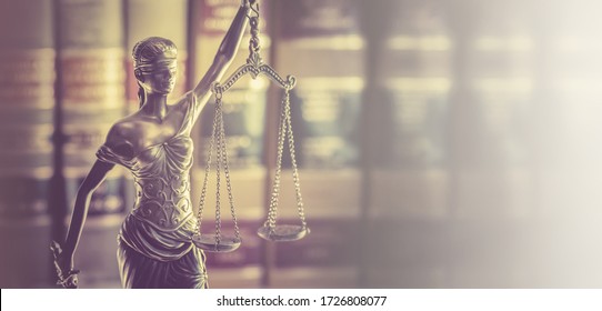 Law office banner concept image, Scales of Justice with legal books in background.   - Shutterstock ID 1726808077