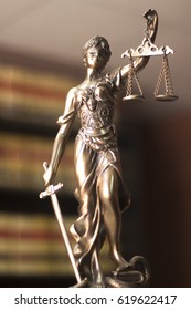 Law offices of lawyers legal statue Greek blind goddess Themis bronze metal statuette figurine with scales of justice.