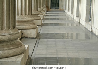 Law And Order Pillars Outside A Courthouse.