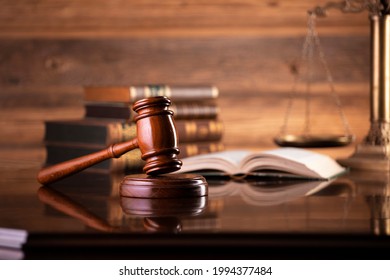 Law symbols on wooden background. 