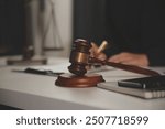 Law theme, gavel or mallet of the judge, lawyer enforcement officers, evidence-based cases taken into account in the court abount business, legislation.