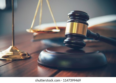 Law theme, mallet of the judge, law enforcement officers, evidence-based cases, and documents taken into account. - Shutterstock ID 1147399469
