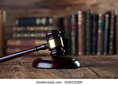 law theme, mallet of the judge, justice scale, books, wooden desk - Shutterstock ID 1036525309