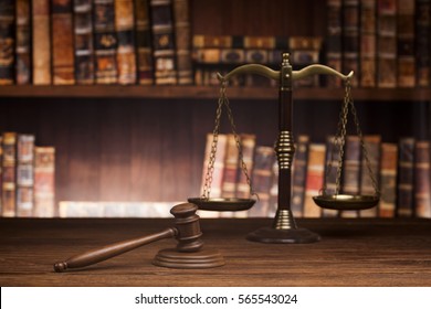 law theme, mallet of the judge, justice scale, books, wooden desk