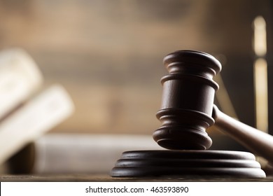 law theme, mallet of the judge, wooden desk, scales of justice, books, statue of justice and hourglass - Shutterstock ID 463593890