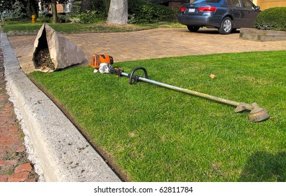 Lawn Care Equipment And Garden Sac In Residential Neighborhood