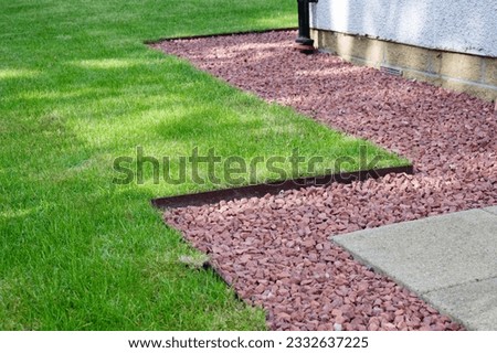 Lawn edging made of metal showing straight and neat finish