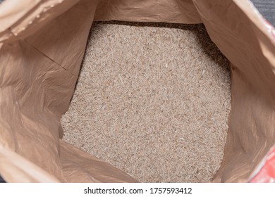 Lawn Grass Seeds In A Large Paper Bag, Top View, Open Package.