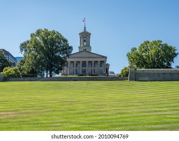 Lawn And Hill Of The Tennessee State Capitol Building In Nashville With The Business District