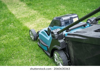 Lawn Mover Machine Cut Green Grass, Hobby Planting Home Garden.