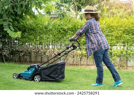 Lawn mover machine cut green grass, Hobby planting home garden. Stockfoto © 