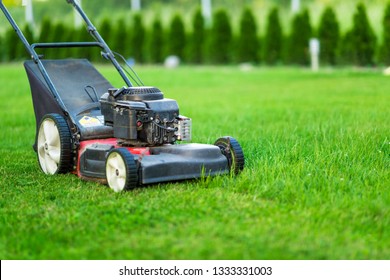 Lawn Mower On Green Grass