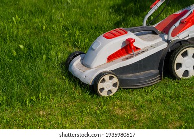 lawn mower on green grass - Shutterstock ID 1935980617