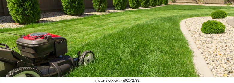 Lawn mower on green grass  - Shutterstock ID 602042792