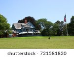 lawn and residential home and american flag pole 