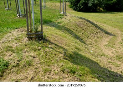 Lawn Uncut In One Half And Regularly Mown To Low Stems In The Other Half. The Mosaic Mowing Of The Meadow Testifies To Insects That Do Not Lose Their Habitats And Eggs Stuck To The Leaves. Hay In Rows