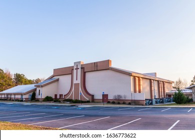 Lawrenceville, GA / USA - January 30 2020: Tabernacle International Church front / side view with parking lot in foreground on Simonton Rd, Lawrenceville, under clear blue skies