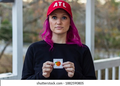 Lawrenceville, Georgia | United States - December 26 2020: A Georgia Voter Holds Up Her 