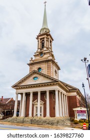 Lawreneville,GA / USA - February 7 2020: Luckie Street Portrait View Of Main Chapel At Lawrenceville First Baptist Church On S Clayton Street, Showing Street Sign And Notice Board Lower Right.