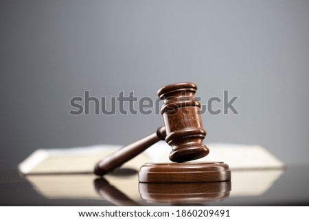 Lawyer background. Law and justice symbols on gray background.