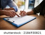 Lawyer, broker or HR manager signing a contract agreement with client or employee. Financial advisor asking for womans signature for insurance, legal paperwork or claim document
