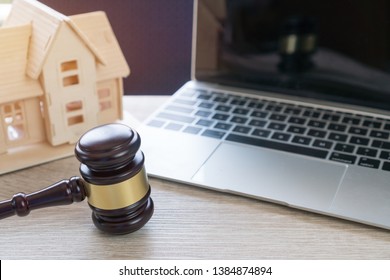 Lawyer Business Real Estate Property Agent, Home Loan Or Divorce. Concept Of Conflict Lawsuit From Not Paying Home Debt, Therefore Requiring Judgment Prosecution. Judge Hammer With House On Computer