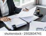 Lawyer businessman working with lawbook in office or courtroom Legal counsel with gavel and legal law. justice and lawyer concept Judge gavel hammer on Lawyer desk