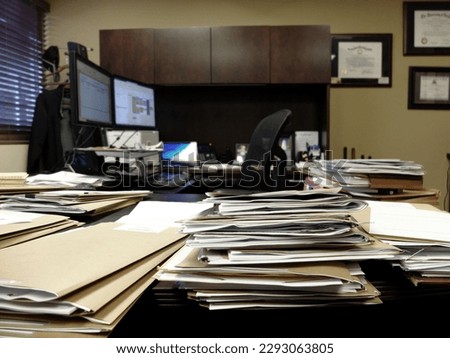 Lawyer or businessman messy office desk with files and papers computer