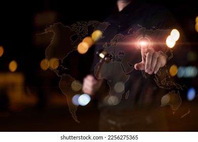 The lawyer clicks on a location point on the world map on a virtual screen. - Shutterstock ID 2256275365