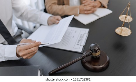Lawyer and client negotiation in legal judgement consulting. - Shutterstock ID 1851702391