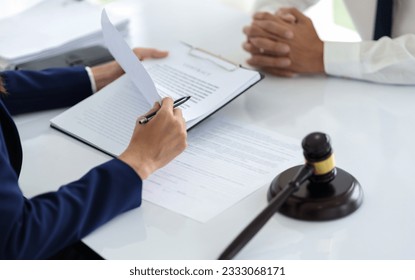 Lawyer and client negotiation in legal judgement consulting. - Shutterstock ID 2333068171