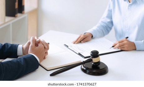 lawyer consultant with client discussing about contract management in court room. - Shutterstock ID 1741370627