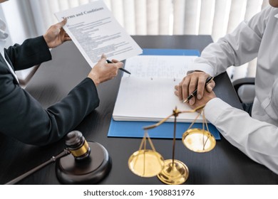 Lawyer Discuss The Contract And Legal Document Agreement In Office. Law And Legal Concept